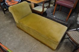 An upholstered daybed ottoman.