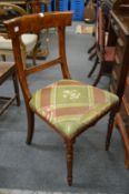 A Victorian faux walnut dining chair.