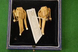 A pair of Christian Dior ear clips.