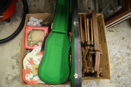 A violin case, old Christmas decorations and quantity of old tennis racket presses.