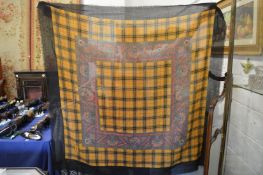 Two head scarfs/shawls both with a check design.