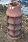 A large terracotta chimney pot.