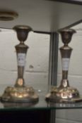 A pair of plated candlesticks.