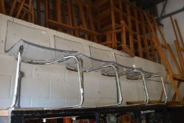 A set of four stylish perspex and chrome dining chairs.