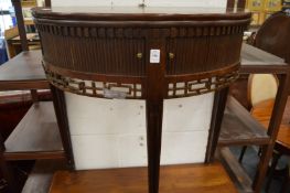 A mahogany demi-lune fold over tea table with tambour storage doors.