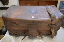 A large leather travelling trunk.
