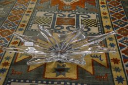 A clear moulded glass dish.