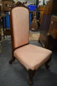 A Victorian rosewood framed and upholstered occasional chair (frame damaged).