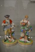 A pair of Dresden figures of a male and female gardener.