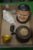 A small paperweight and other collectables.