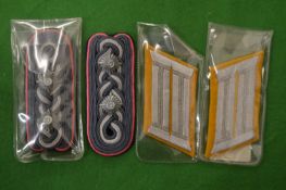 Two pairs of military lapels badges.