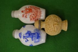 Three Chinese snuff bottles.