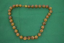 A good small amber bead necklace of large beads.