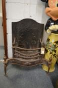 A Regency style cast iron fire place with back.