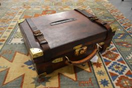 A good brass bound leather shotgun case.