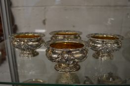 A good set of four Neo Classical style cast silver and silver gilt pedestal salts.