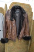 Emporio Armani, a Ladies fur trimmed brown leather jacket, size 8.