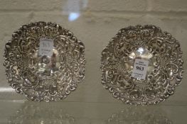 A pair of embossed and pierced silver bon bon dishes.