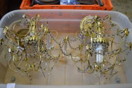 A pair of decorative chandeliers.