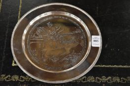 A silver circular equestrian presentation plate.