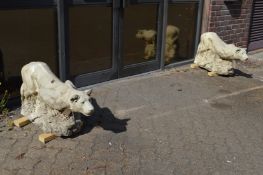 A good pair of reconstituted stone garden ornaments modelled as prowling lions.
