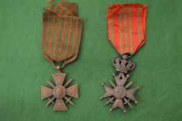 Two military badges.