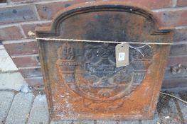 A small cast iron fireback.