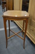 A small mahogany shaped top occasional table, label to the underside Imperial, Grand Rapids,