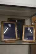 A set of three Hallmark silver photograph frames.