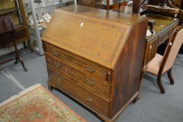 A George III oak bureau.