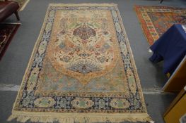 A Persian carpet, cream ground with stylised decoration, 219cm x 138cm.