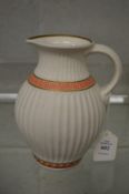 A classical revival painted and gilt decorated parian china jug.