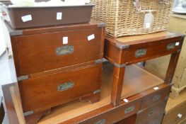 A military style mahogany two drawer chest and matching coffee table.
