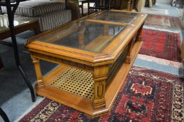 A large glass top rectangular coffee table and a similar lamp table.