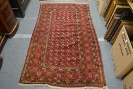 A Persian bokara rug, 195cm x 114cm.