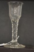 A large 18th century English glass with faceted cut stem.