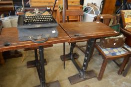 A pair of old pine and cast iron school desks.