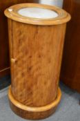 A Victorian mahogany and marble top cylindrical pot cupboard.
