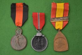 Three various medals.