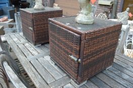 A pair of garden storage cubes with glass tops.