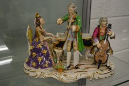 A large Dresden porcelain centre piece of three musicians.