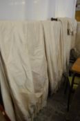 A good large quantity of cream curtains with matching pelmets.