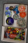 A collection of glass paperweights and glass models sweets.