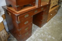 A military style twin pedestal desk.