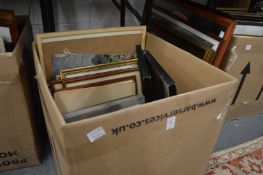 A box of assorted paintings and prints.