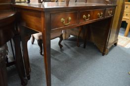 A mahogany three drawer side table.