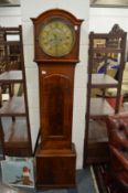 A 19th century mahogany longcase clock with circular brass dial.