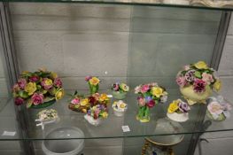 A group of floral encrusted china.