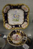 A floral decorated cup and saucer and similar dish.