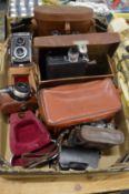 Cameras and binoculars to include a Zeiss Ikon, a Yashika etc.